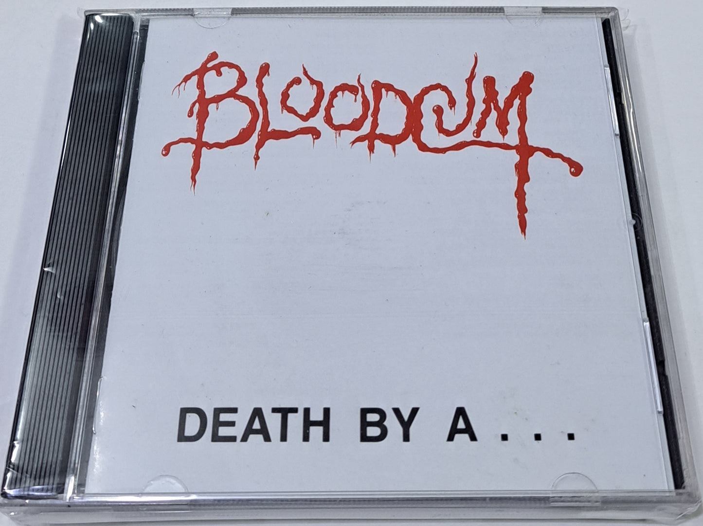 BLOODCUM - DEATH BY A CD